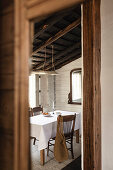 Dining room with white wooden walls in a rustic style