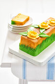 Loaf tin cake with yellow flowers and green leaves made from fondant