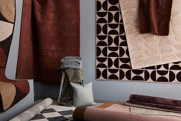 Various patterned rugs on the wall and on the floor