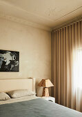 Bedroom with textured walls and ceiling stucco