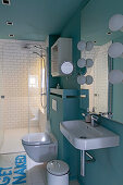 Modern bathroom with walk-in shower and blue walls