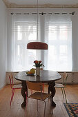 Rustic dining table with fruit bowl and bouquet of flowers
