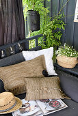 DIY cushions made from fringed rugs on an outdoor sofa in the garden