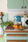 Vintage kitchen with green cabinets and retro decor
