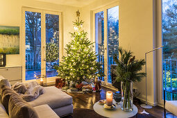Christmas tree and presents in a modern apartment in Hamburg, north Germany, Germany