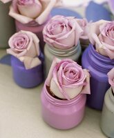 Roses in painted jars