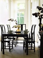 Black dining table, chairs and cabinet