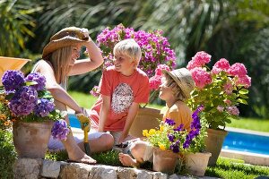 Mother and children gardening