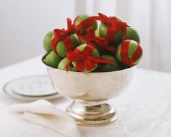 Green apples with red bows