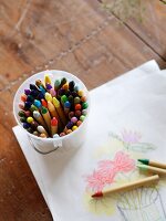 Child's drawing and coloured crayons