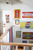 Staircase banister and wall decoration made from vintage advertising signs