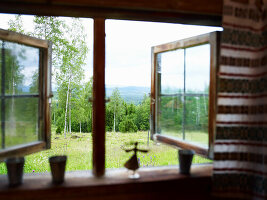 Open window with view of green landscape