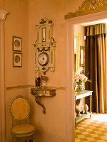 Antique barometer and door decoration in the hallway of a historic house