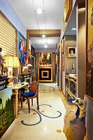 Gallery of modern object d'art, paintings and gilt furniture in hallway