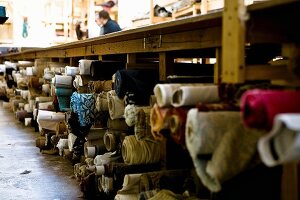 Bolts of fabric in upholsterer's workshop