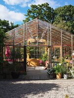 Glazed greenhouse in garden