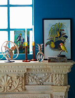 Decorative objects and fan on a mantelpiece made of hand-carved marble