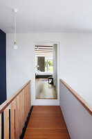 Narrow hallway on the upper floor, view into the bedroom