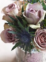 Posy of dusky pink roses and sea holly