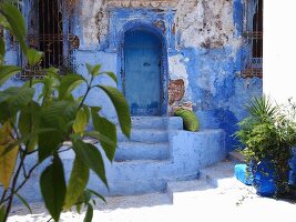 The entrance to a house in one of the blue alleyways of Chefchaouen, Morocco