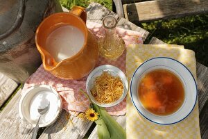 Ingredients for hand soak or scrub; honey, marigolds and milk