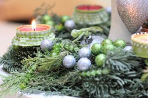 Advent wreath hand-decorated with green and silver baubles