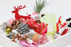 Christmas decorations in white display case