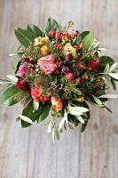 Bouquet of roses, olive branches, St. John's wort and cherry laurel