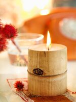 Lit candle inside bamboo stem