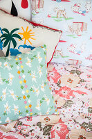 Colourful scatter cushions on bed in child's bedroom