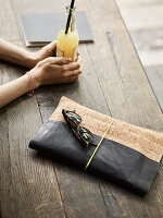 A homemade clutch made from leather and cork