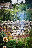 Tripod over fire pit in garden