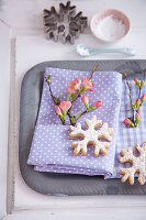 Sprig of flowers and snowflake biscuit decorating napkin