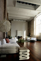 Large living room in industrial building with high ceiling