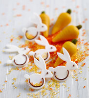 Edible Easter decorations: marzipan carrots and fondant bunnies with coloured sugar
