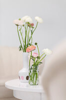 Ranunculus in vases on table