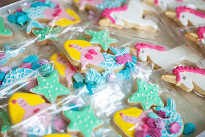 Ornately decorated mermaid and unicorn biscuits