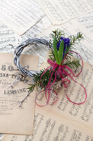Small wreath with hyacinth on music sheets