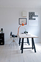 Desk on trestle legs in a minimalist study