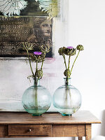 Glass ball vases on wooden table