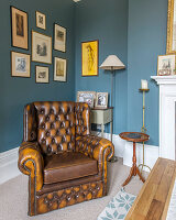 Chesterfield armchair in classic living room decorated in blue