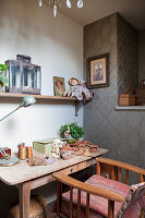 Fabric and sewing utensils on rustic table with drawer