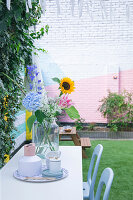 Brightly painted brick wall of courtyard garden