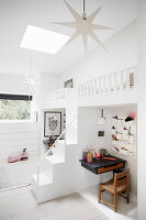 White twin loft beds above desks in sibling's bedroom