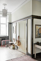 Miniature ice hockey goal in corner of room with marbled wall panelling