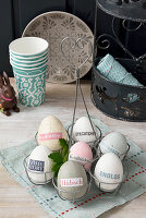 Eggs decorated with magazine clippings in various natural shades