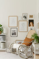 Cosy rocking chair and picture gallery in light corner of room