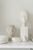 Sculptures on white shelf