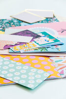 Construction paper with various printed patterns in pastel shades