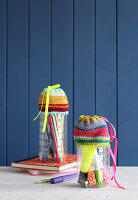 Pen holders made from PET bottles with crocheted covers